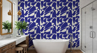 Blue cut-out wallpaper in a bathroom with a freestanding tub and vanity GD12480