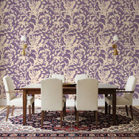 Plum and cream botanical wallpaper in a softly lit bedroom GD12484