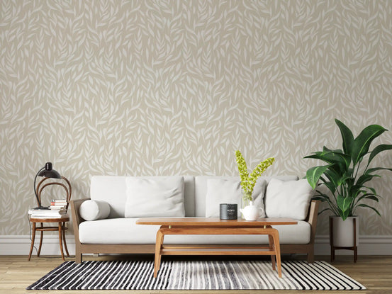 Neutral leaf wallpaper in a living room with cream sofa and wooden coffee table GD12486