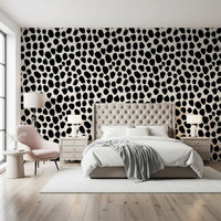 Black and cream spotted wallpaper in a dining room with wooden table GD12487