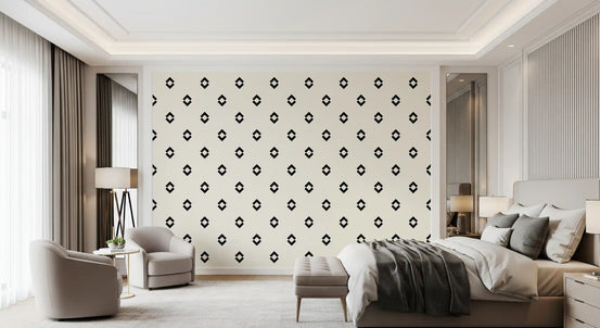 Black and white geometric diamond wallpaper in a neutral bedroom with grey bedding GD12502
