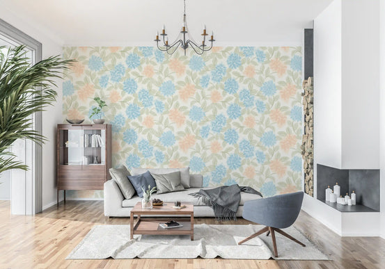 Watercolour floral wallpaper in a bright living room with grey sofa and fireplace GD12638