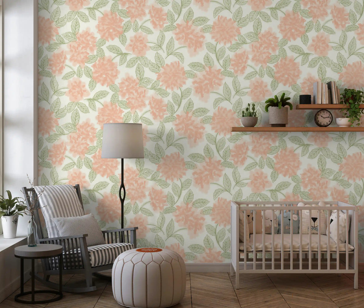 Nursery corner in peach and sage botanical wallpaper with a cot and neutral decor GD12646