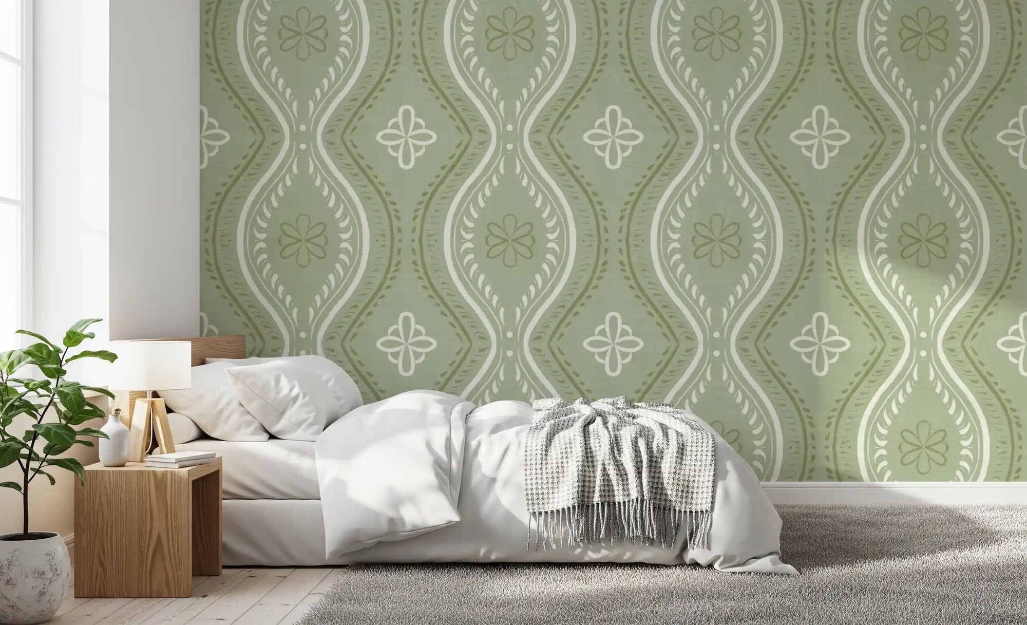 Green ogee damask wallpaper behind a bed in a soft neutral bedroom GD12666