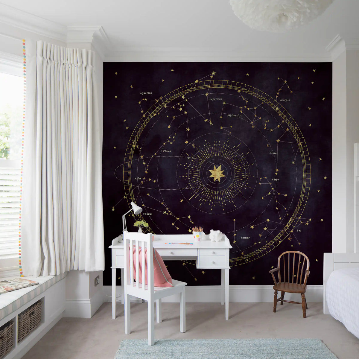 Gold constellation mural above a white study desk in a kids room GD12716