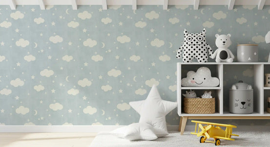 Blue cloud and star wallpaper in a nursery with a cloud shelf and toys GD12753