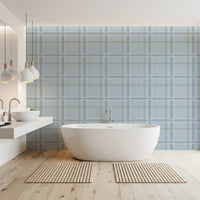 Blue windowpane check wallpaper in a bright bathroom with a freestanding tub GD12760