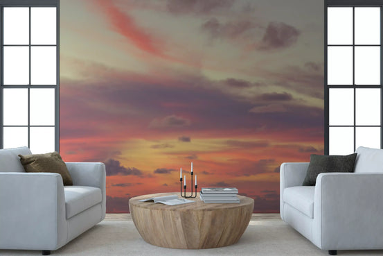 Sunset sky mural between two armchairs in a bright living room GD12844