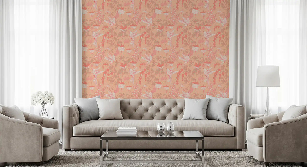 Peach hummingbird floral wallpaper behind a grey sofa in a bright living room GD12851