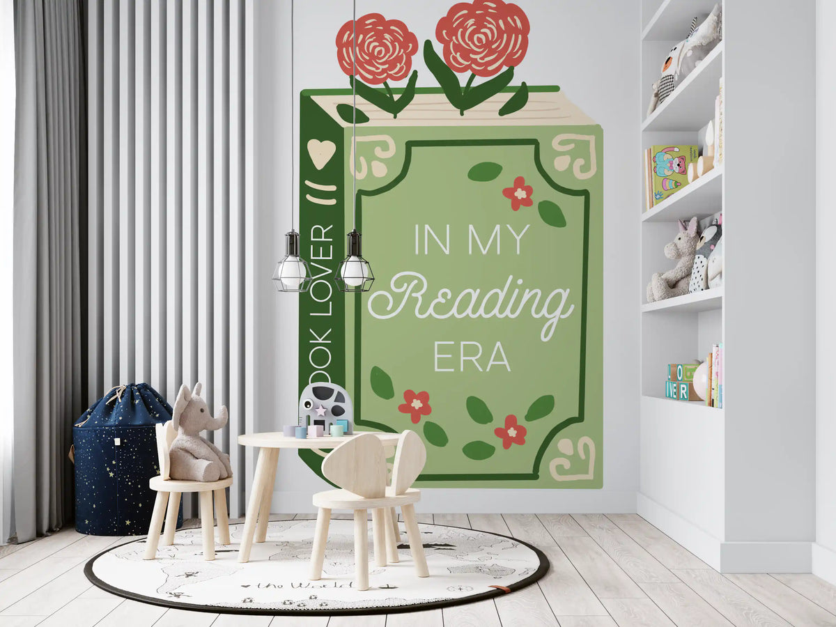 Green book reading mural in a toddler playroom with a small table and chairs GD12895