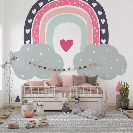 Rainbow cloud mural in a kids room with a white daybed and pink cushions GD12898