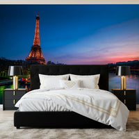 Landscape wall mural of Paris at night with a glowing Eiffel Tower and blue river, GD13030