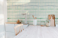 Artistic handdrawn lines wall design in green tones
