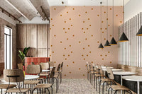 Retro minimal polka dot wallpaper in warm terracotta on creamy pink.