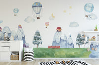 Children's wallpaper with whimsical mountains and homes
