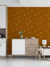 Boho dot wallpaper in orange tone for hallway feature wall.