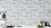 Whimsical smokey cabins wallpaper in blue for playful, cozy rooms.
