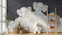 Baby elephants resting on clouds wallpaper
