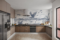 Graceful herons flying over a lake
