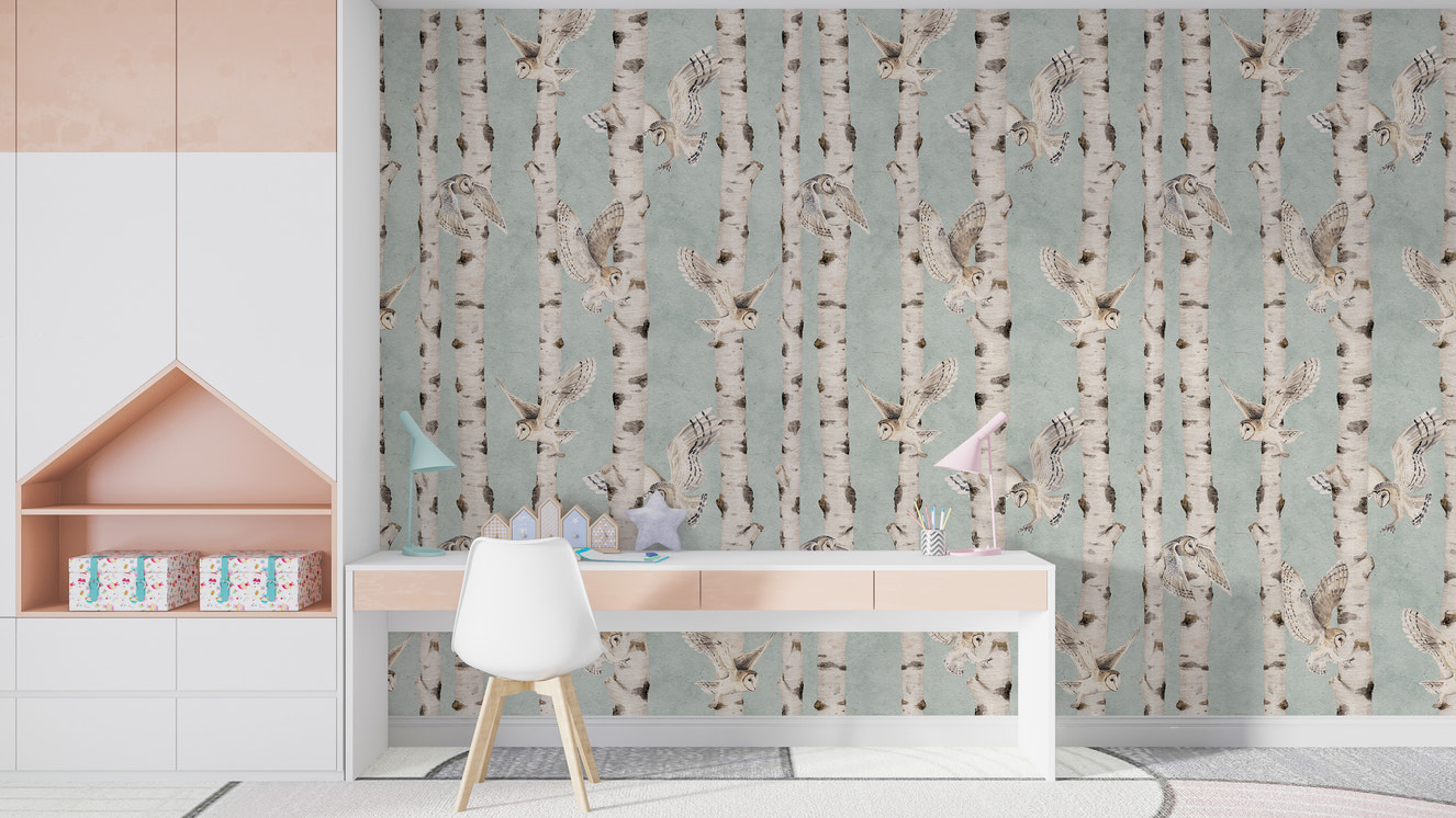 Elegant owls among birch tree trunks
