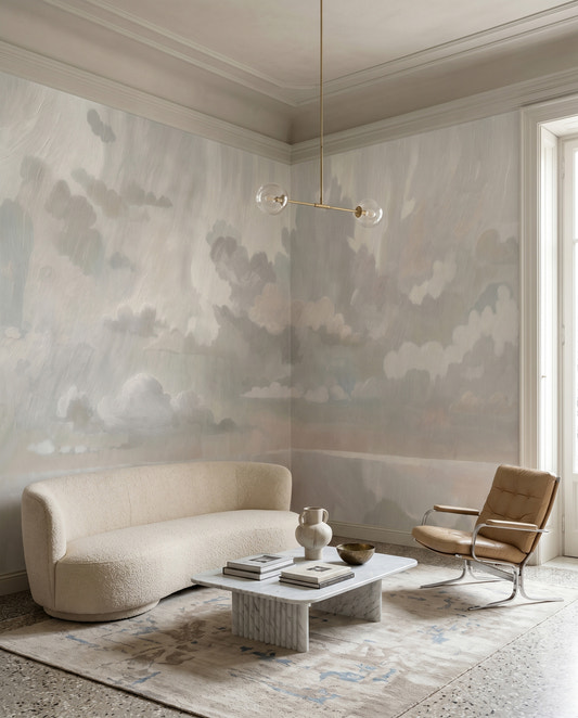 Muted neutral cloud wall mural with mirrored reflections in a hallway.