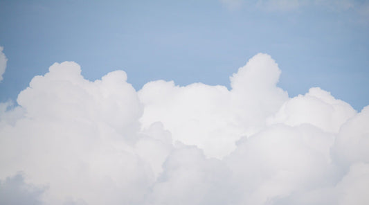 Blue Sky and Fluffy White Cloud Wallpaper