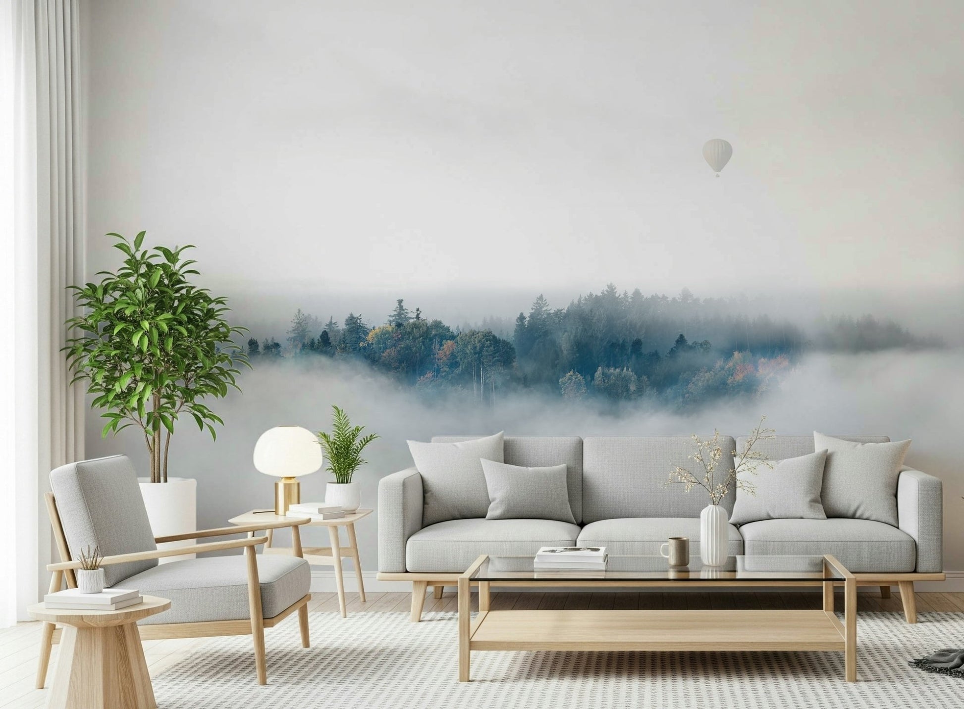 A beautiful panoramic vista wallpaper mural of mountain peaks rising above the mist.