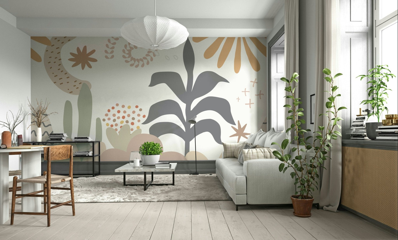 An abstract wall mural featuring a pattern of stylized leaves.

