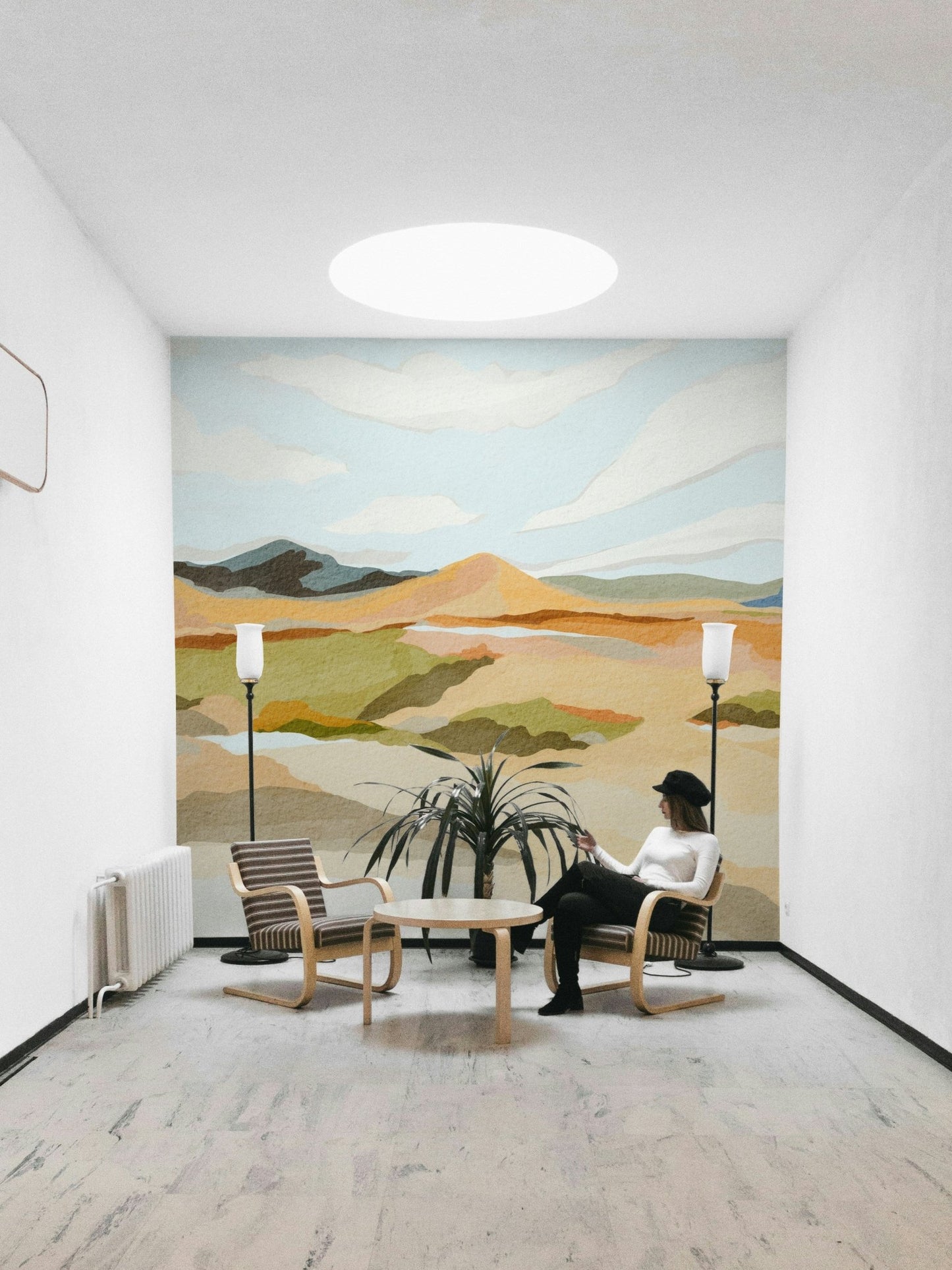 Modern mountain mural in abstract layered tones

