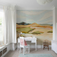Graphic mountain landscape mural in warm hues

