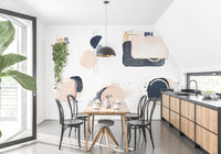 Artistic abstract shape mural with gold detailing.