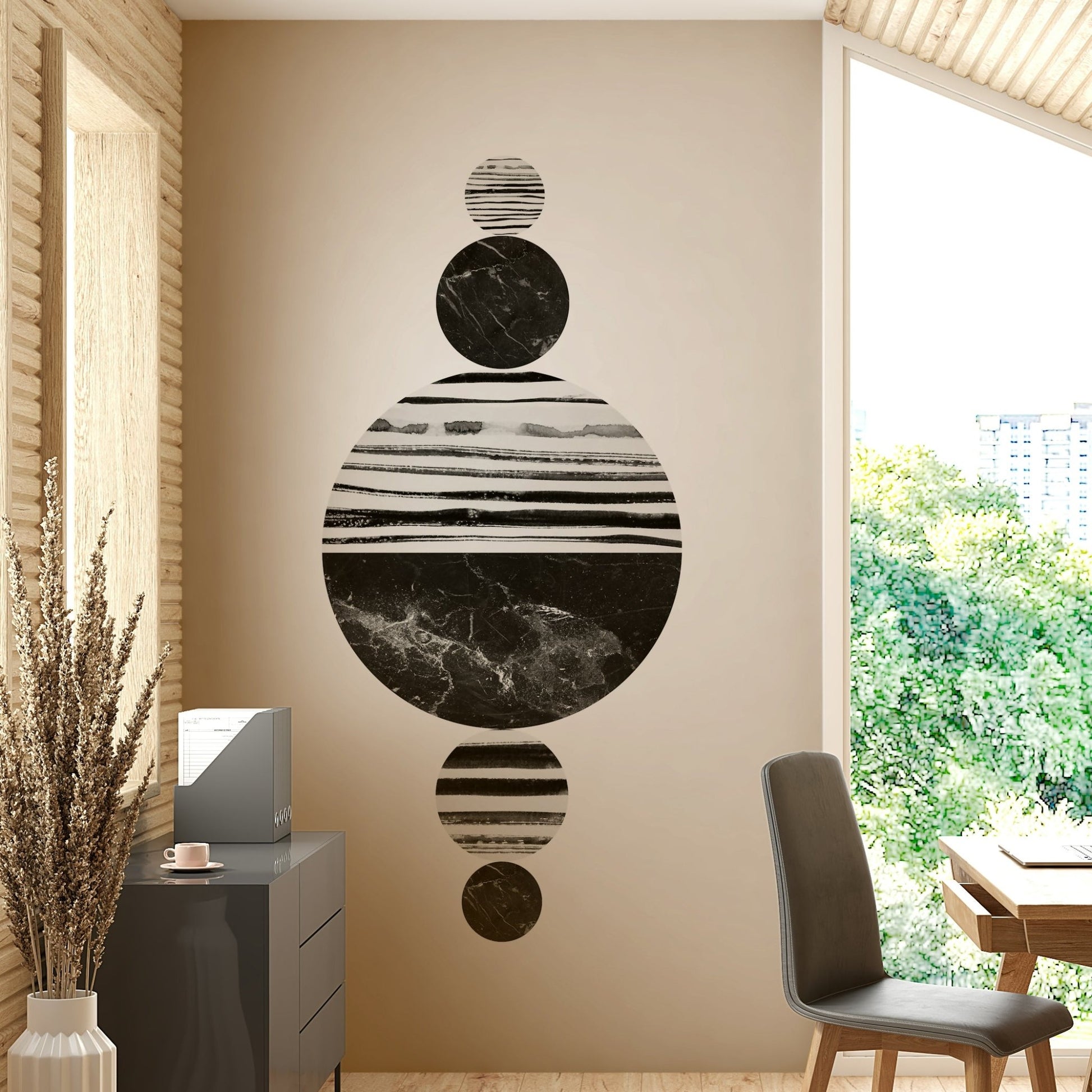 Black and white marble circles arranged vertically in a symmetrical formation.

