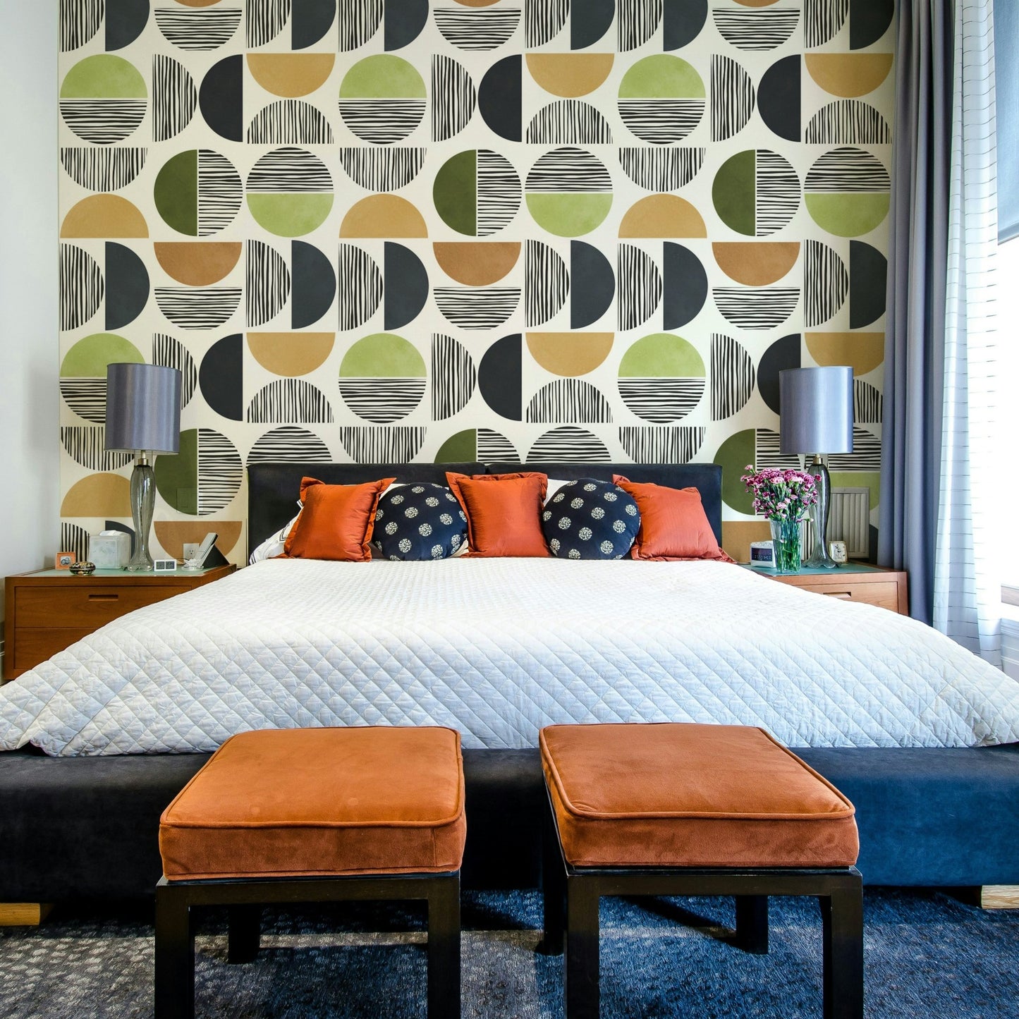 The design suggests a sun and a landscape.

