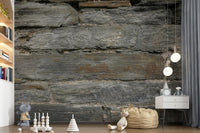 Aged stone wallpaper mural behind a dining table., GD6068