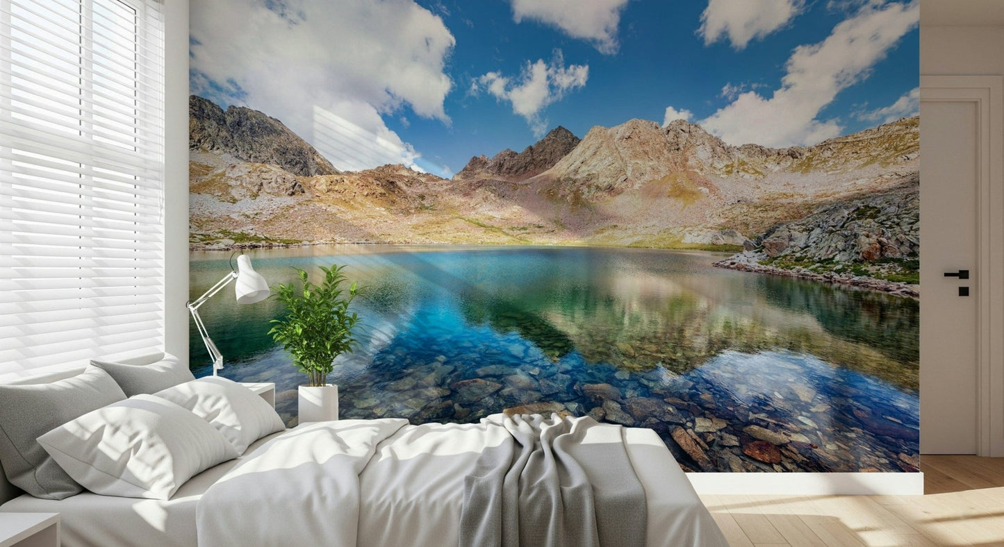 Beside the bed, Alpine Azure Wall Mural creates a calm lakefront focal point
