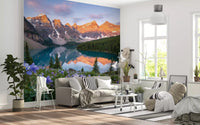 Wildflowers and turquoise water fill a living room with Alpine Glow Blooms wall mural.GD9535