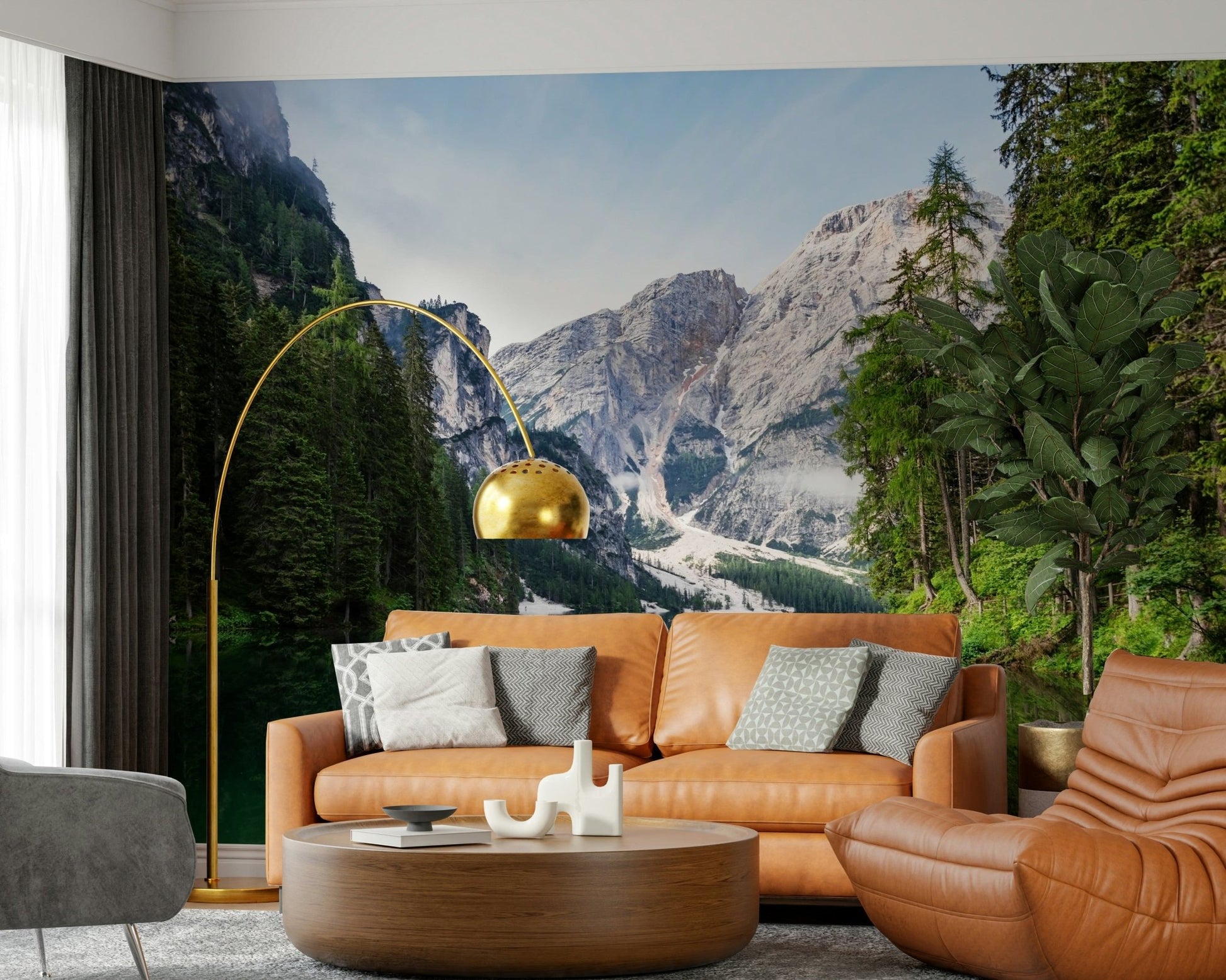 A warm lounge feels grounded by Alpine Reflections Wall Mural and forested peaks