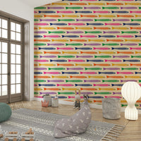 Bright fish with rainbow hues on cream-colored wallpaper

