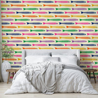 Anchovies bright rainbow fish on cream wallpaper design

