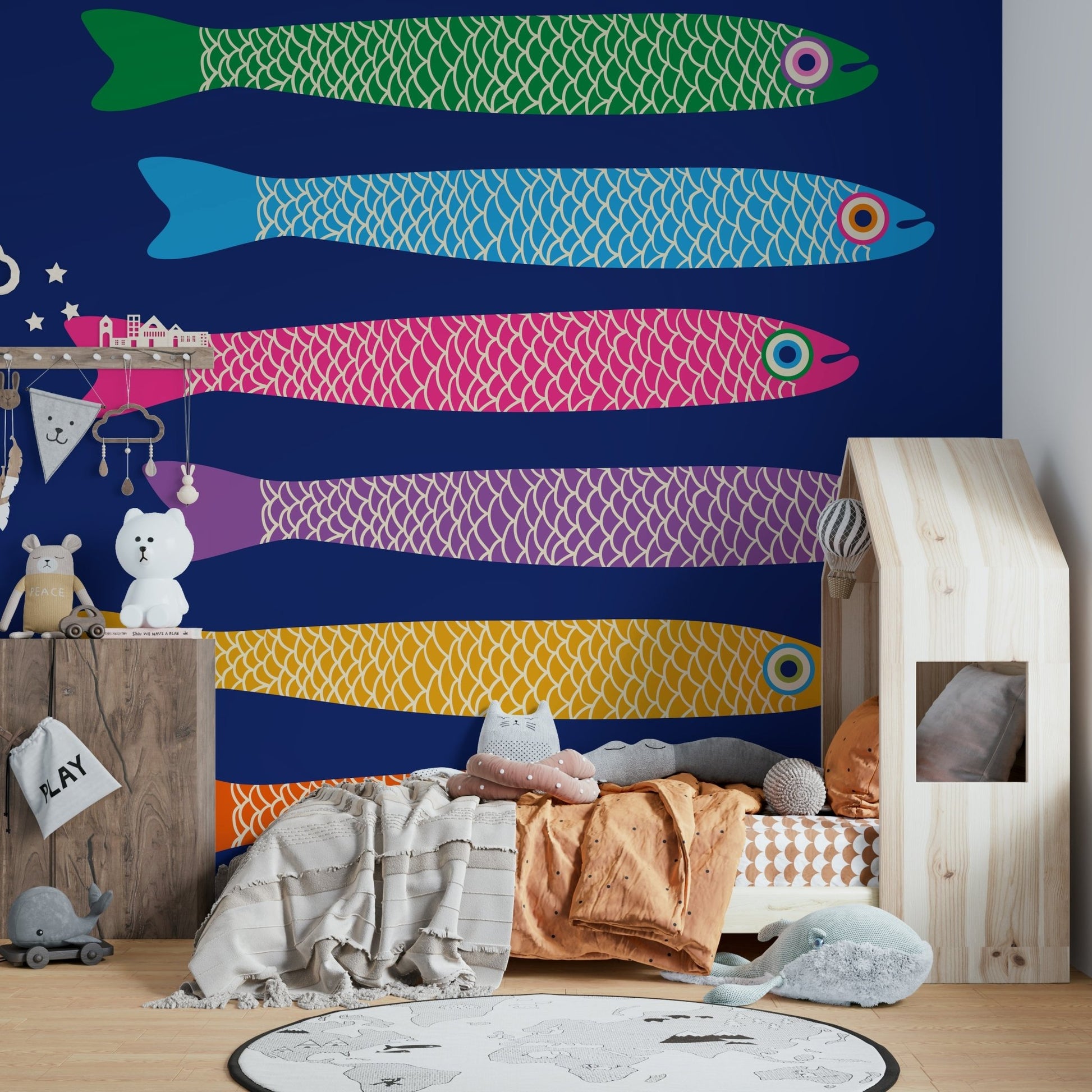 Royal blue wall with rainbow-colored anchovies.

