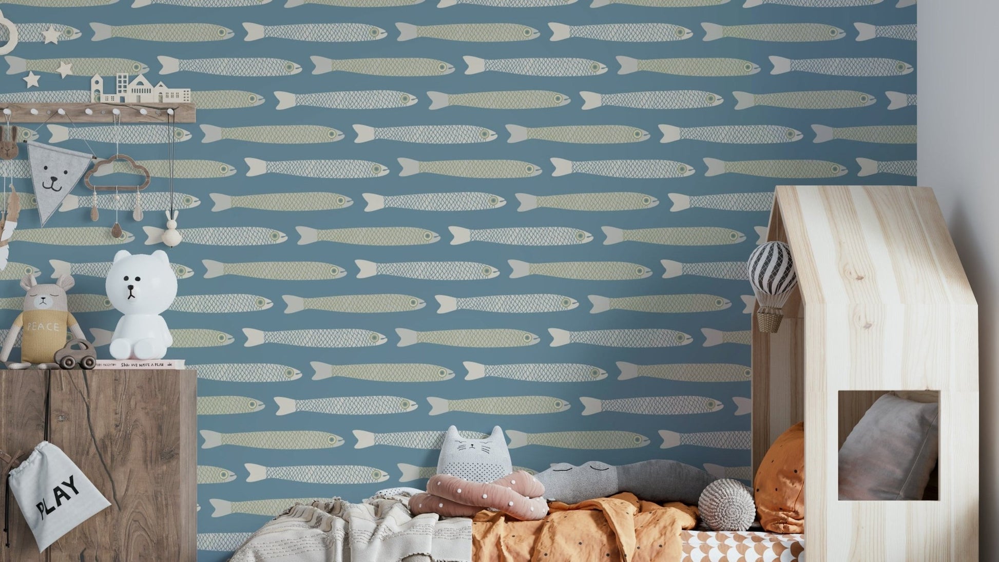 Cream and sage fish on light blue wallpaper