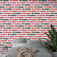 Red pink black fish on white wall
