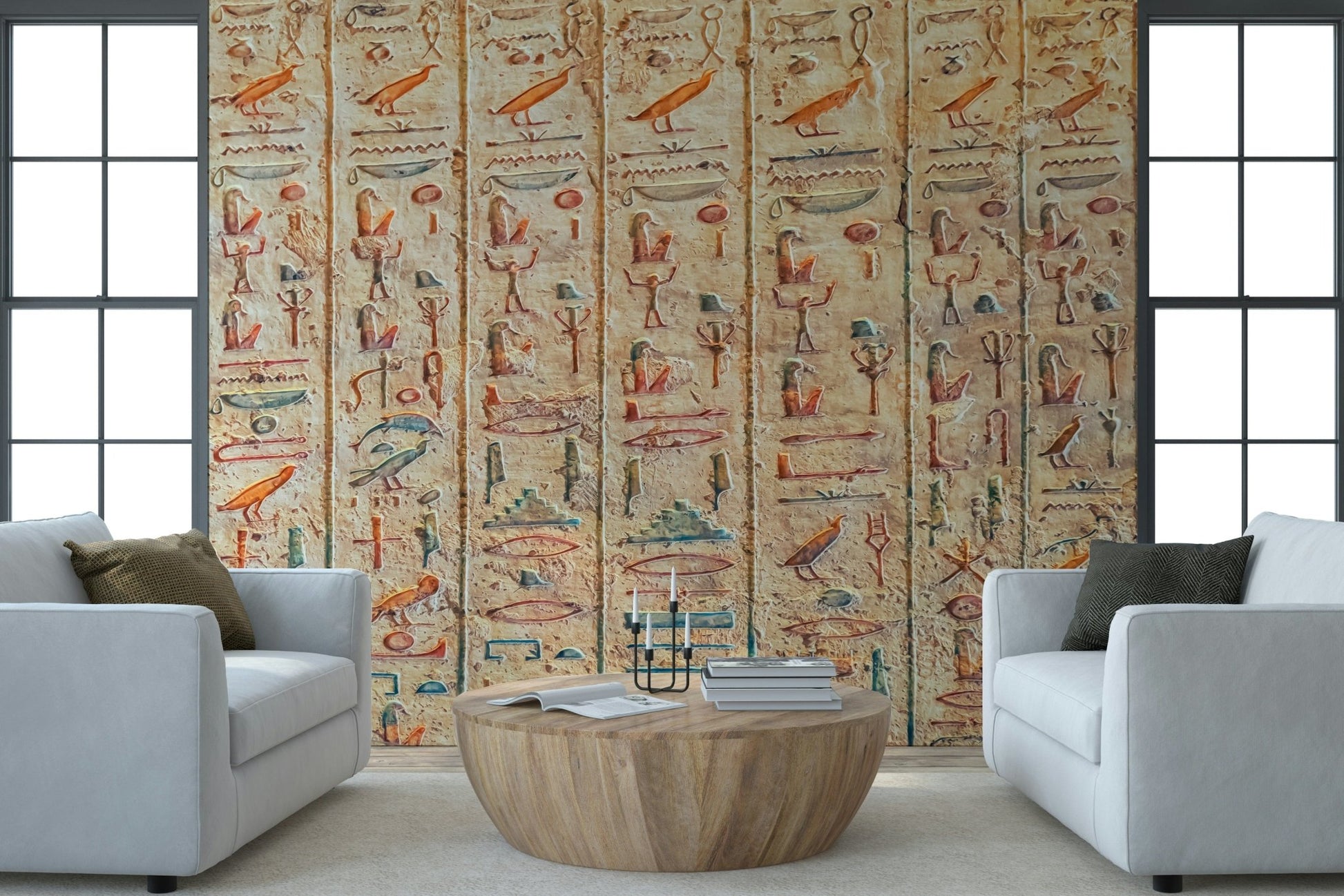 Ancient Glyphs Wall Mural adds old-world wall detail to this bright open seating room