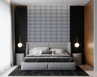 A serene bedroom backdrop created by installing the blue Art Deco Ocean Shells Wallpaper.