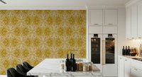 Amber gold wallpaper layered with art nouveau butterfly and floral scrollwork