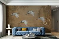 An elegant wall mural with a pattern of birds and cherry blossoms.

