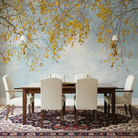 Autumn Hues Woodland wall mural, golden leaves, soft autumn sky, birch tree branches.