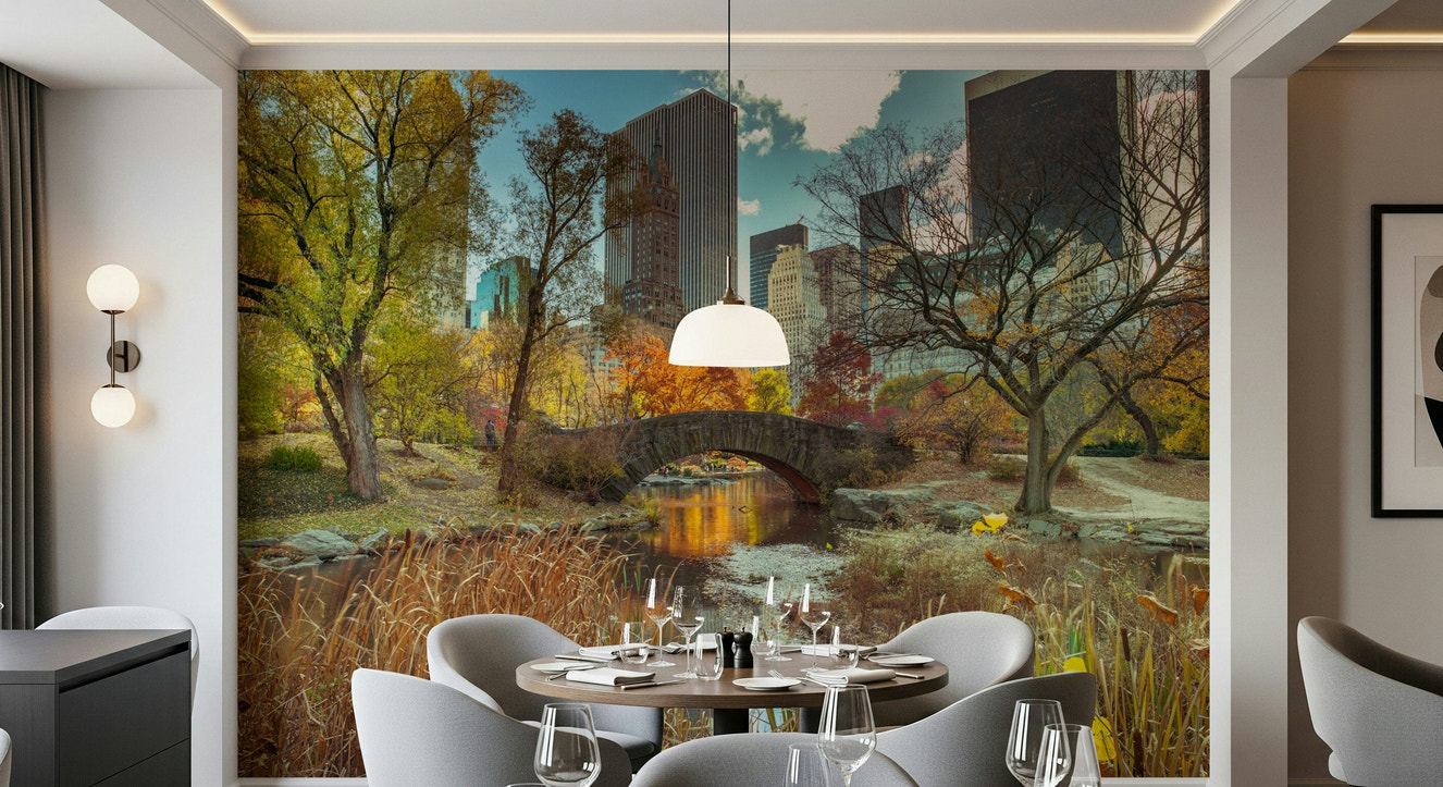 Manhattan's Autumn Embrace Wall Mural with orange fall trees and city buildings.