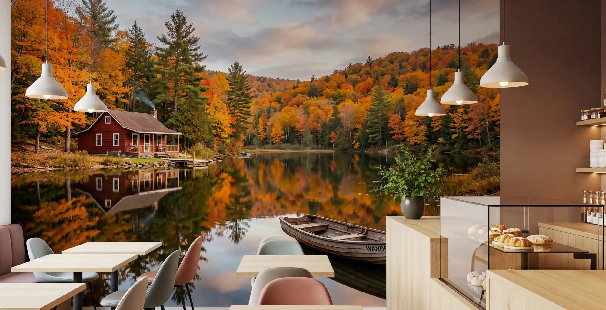 Café dining area up into Autumn Lakeside Dream wall mural with red cabin views.
GD9540