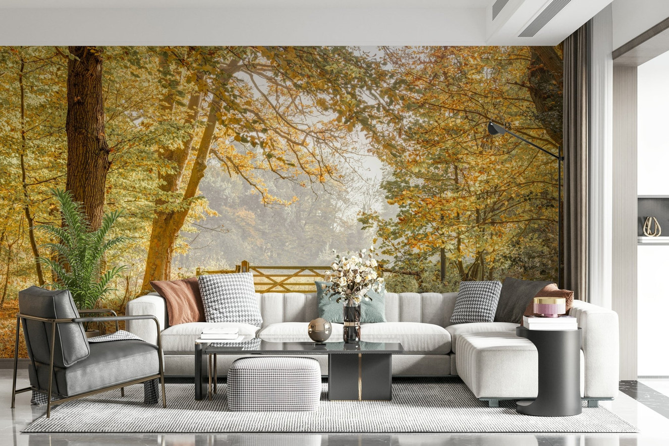 Autumn's Gateway Wall Mural featuring a golden forest path in a spacious living room.
